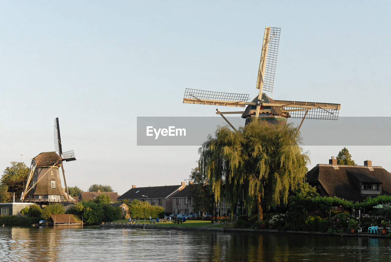 Traditional windmill against clear sky
