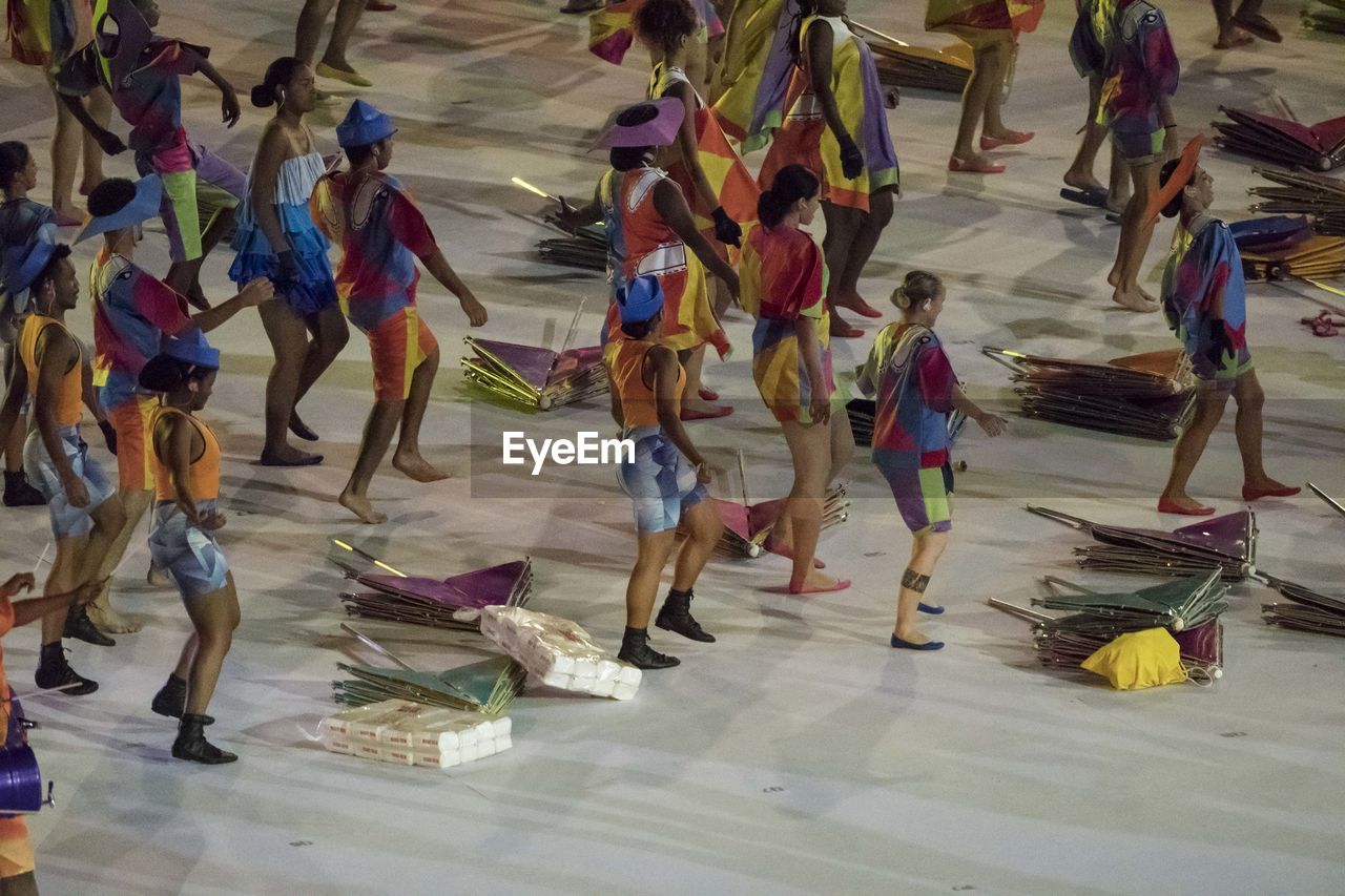 LOW SECTION OF PEOPLE STANDING ON FLOOR IN SHOPPING MALL