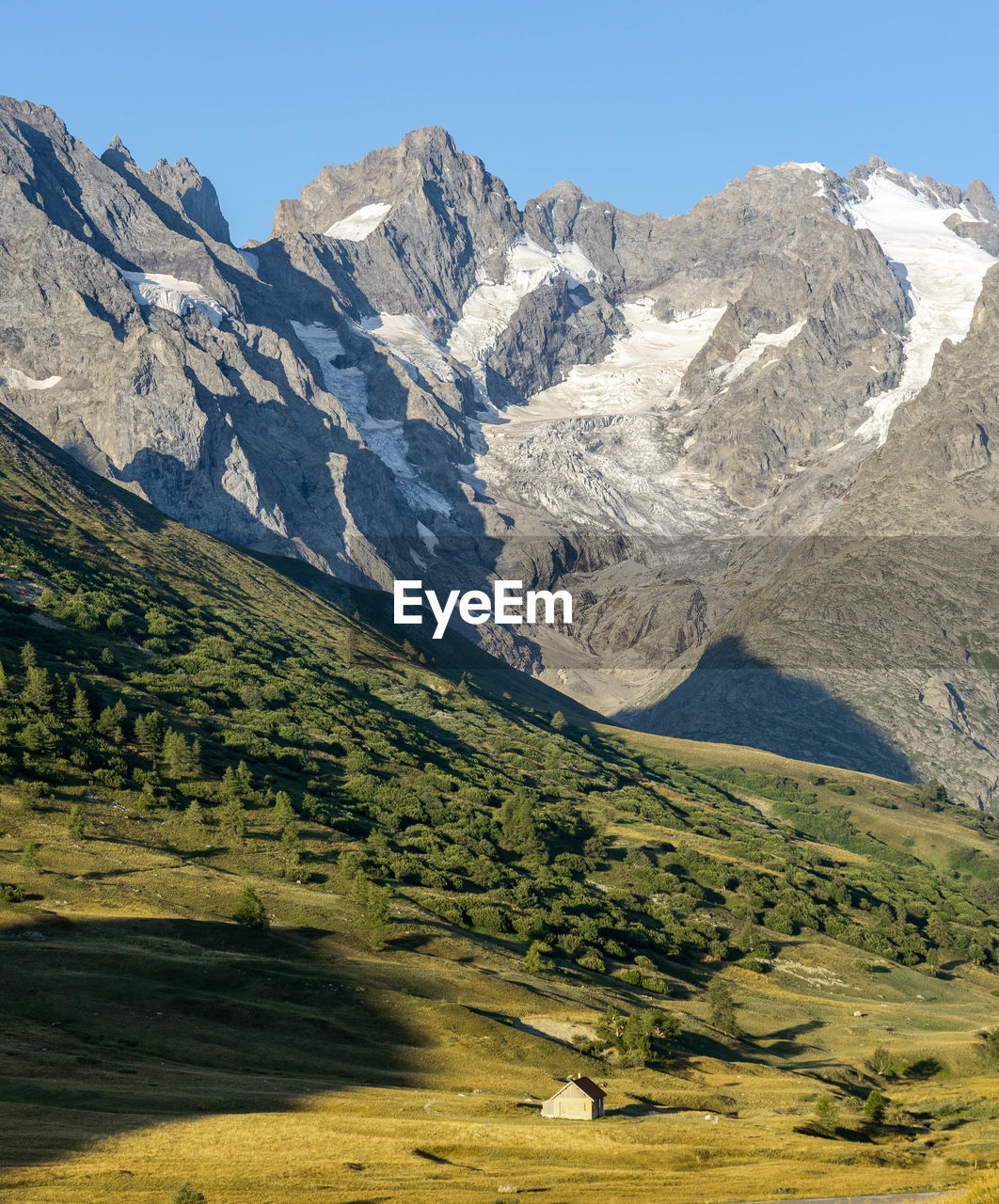 Scenic view of snowcapped mountains against clear sky