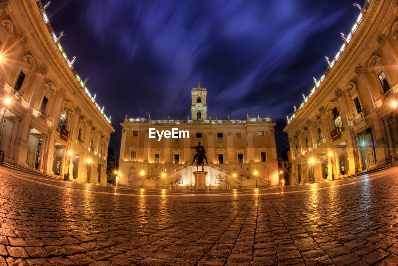 VIEW OF ILLUMINATED BUILDINGS AT NIGHT