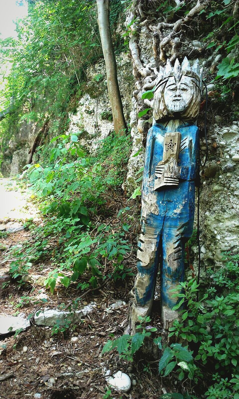 Abandoned statue in forest