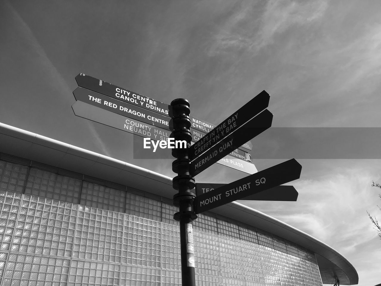 Low angle view of road sign against sky