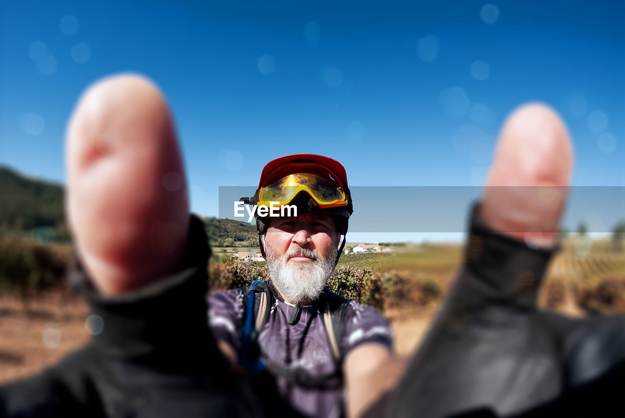 sky, men, adult, nature, portrait, blue, glasses, outdoors, day, sunglasses, fun, landscape, selective focus, human face, person, headshot, two people, goggles, emotion, clear sky, adventure, clothing, land, sunlight, fashion, sunny