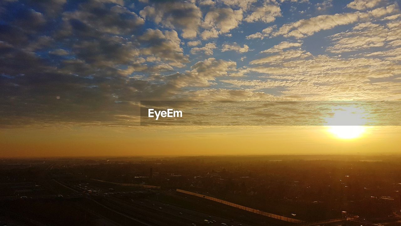 AERIAL VIEW OF CITY DURING SUNSET