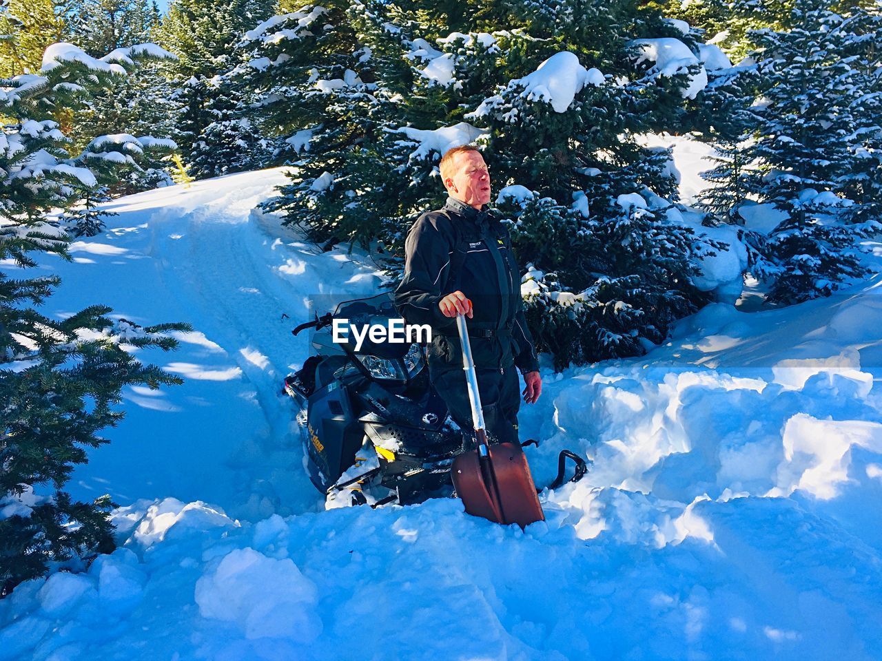 Full length of man standing on snow