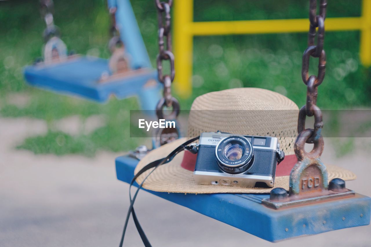 CLOSE-UP OF CHILD PHOTOGRAPHING ON CAMERA