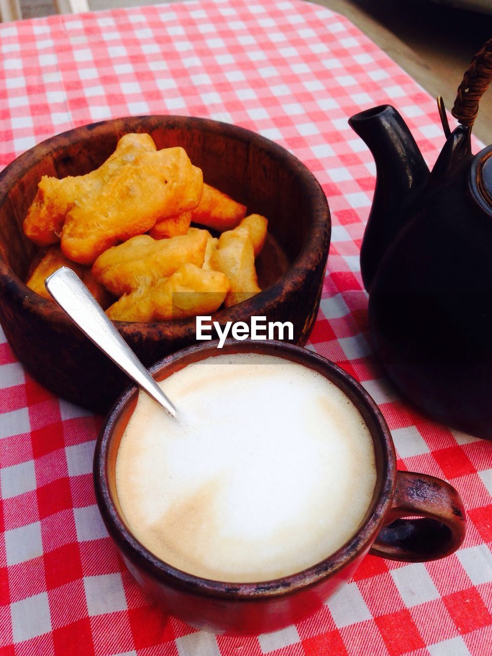 Close-up of snacks served with coffee