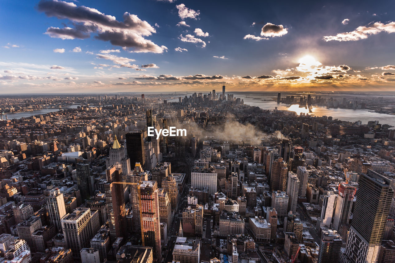 High angle view of city against sky during sunset