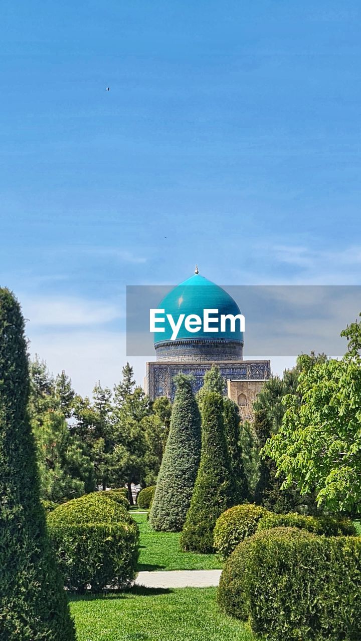 plant, dome, architecture, sky, built structure, building exterior, nature, tree, green, garden, formal garden, no people, blue, hedge, travel destinations, observatory, city, religion, travel, landmark, outdoors, building, day, grass, sphere, topiary