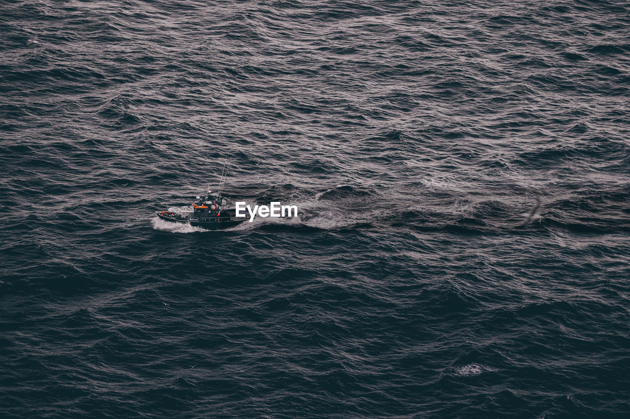 High angle view of boat sailing in sea