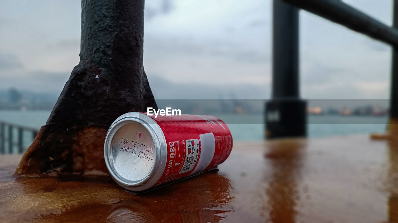 water, red, focus on foreground, sky, nature, no people, day, architecture, close-up, outdoors, drink, metal