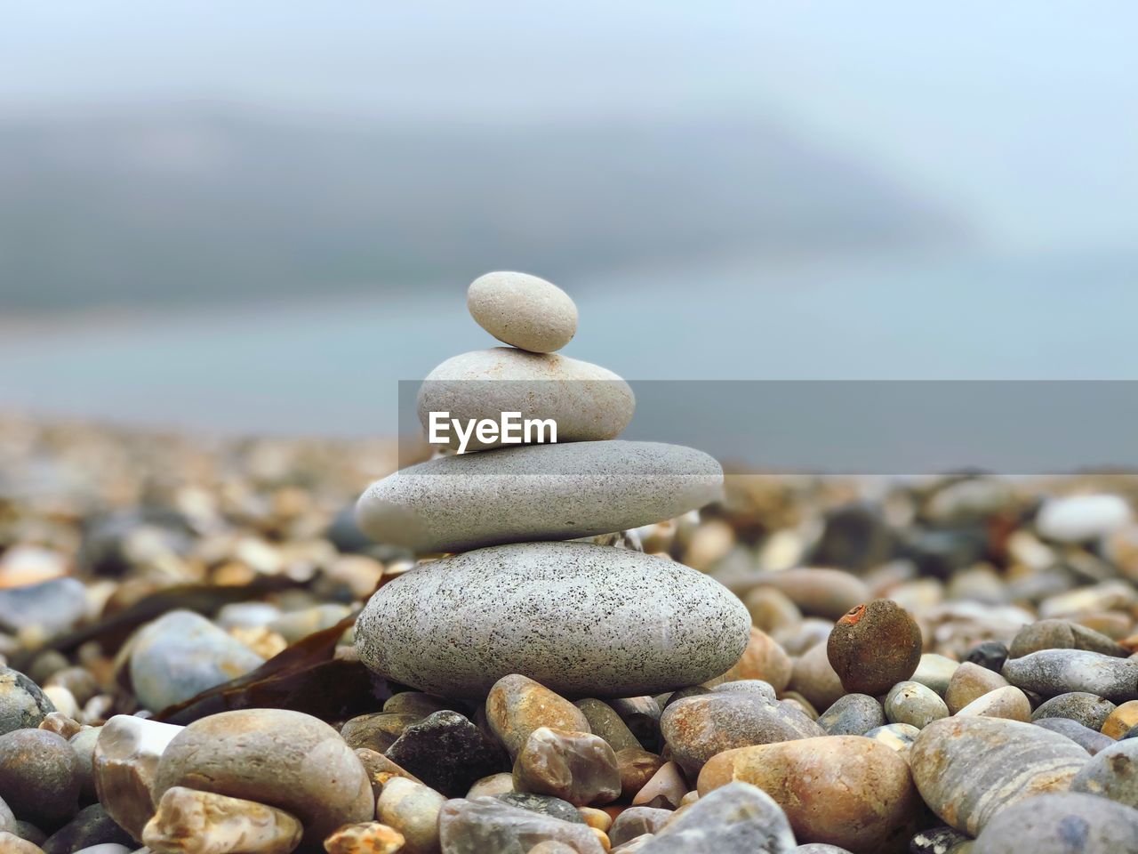 CLOSE-UP OF STONE STACK ON ROCK