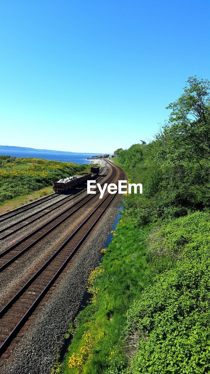 Railroad track against blue sky