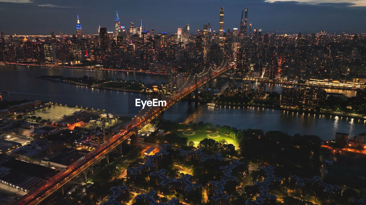 High angle view of illuminated buildings in city at night,new york