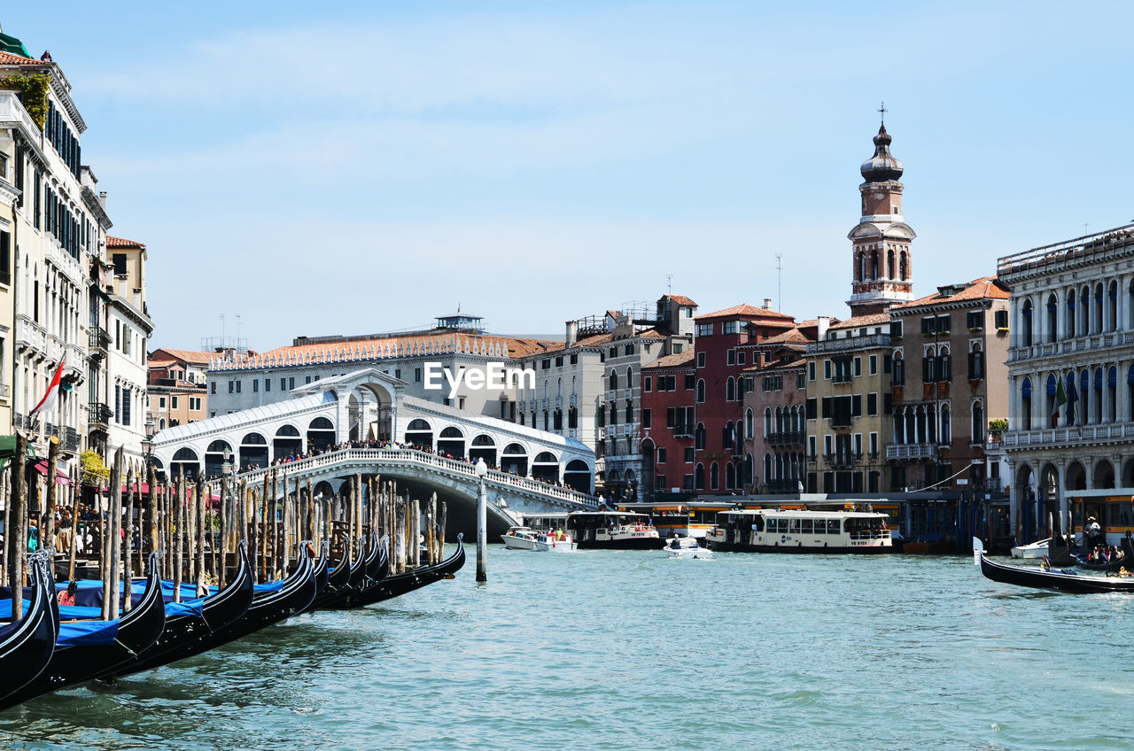 Canal passing through city buildings venice