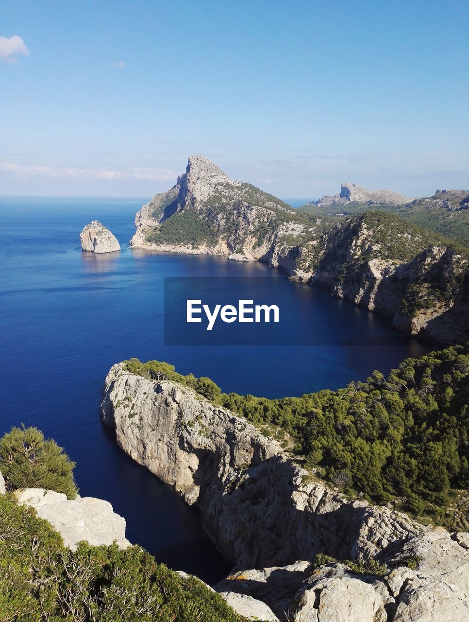 Scenic view of sea and rocks against sky