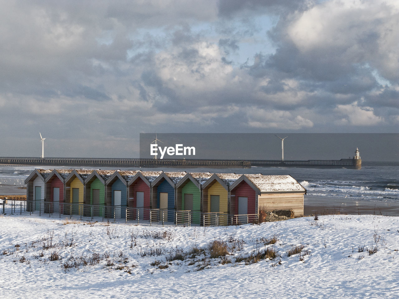 Built structure on beach against sky