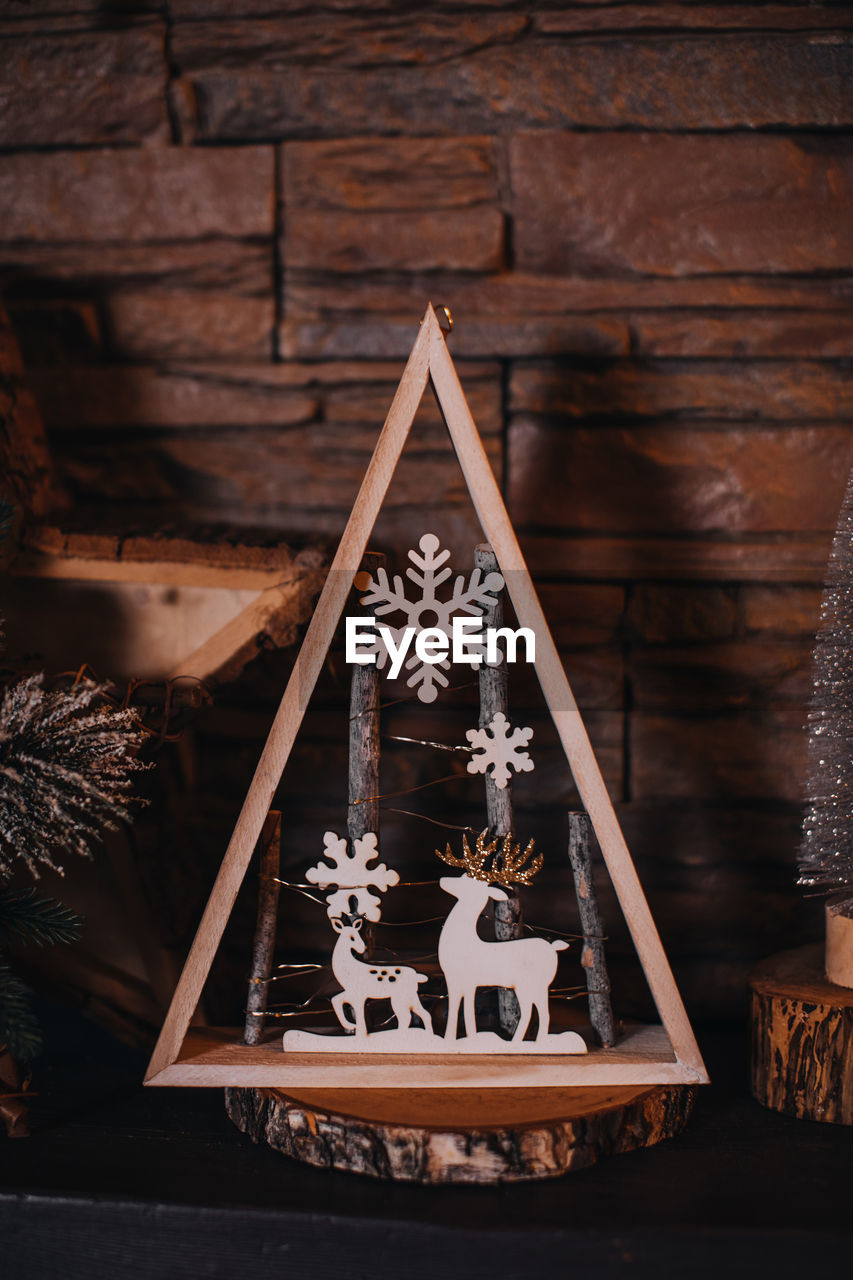 Christmas wooden composition with magic deer. atmospheric festive new year indoor decoration