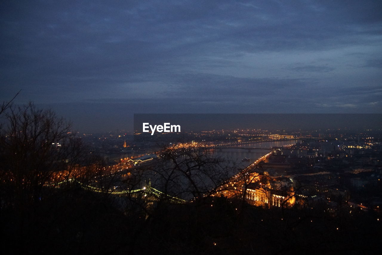 High angle view of illuminated cityscape against sky