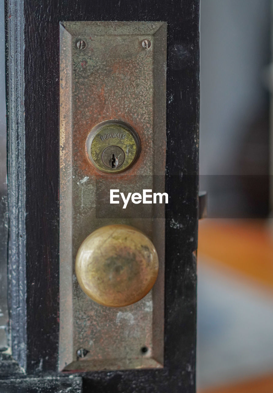 Close-up of old metal door lock