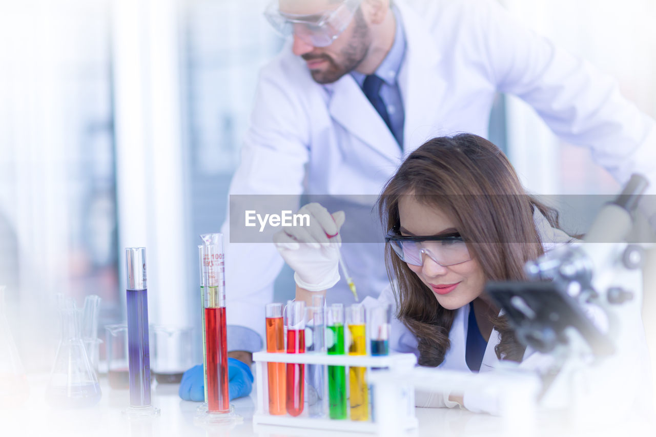 SENIOR WOMAN LOOKING AT CAMERA IN OFFICE