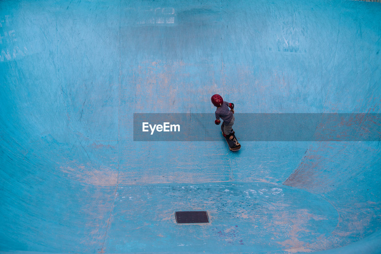 High angle view of boy skateboarding at park
