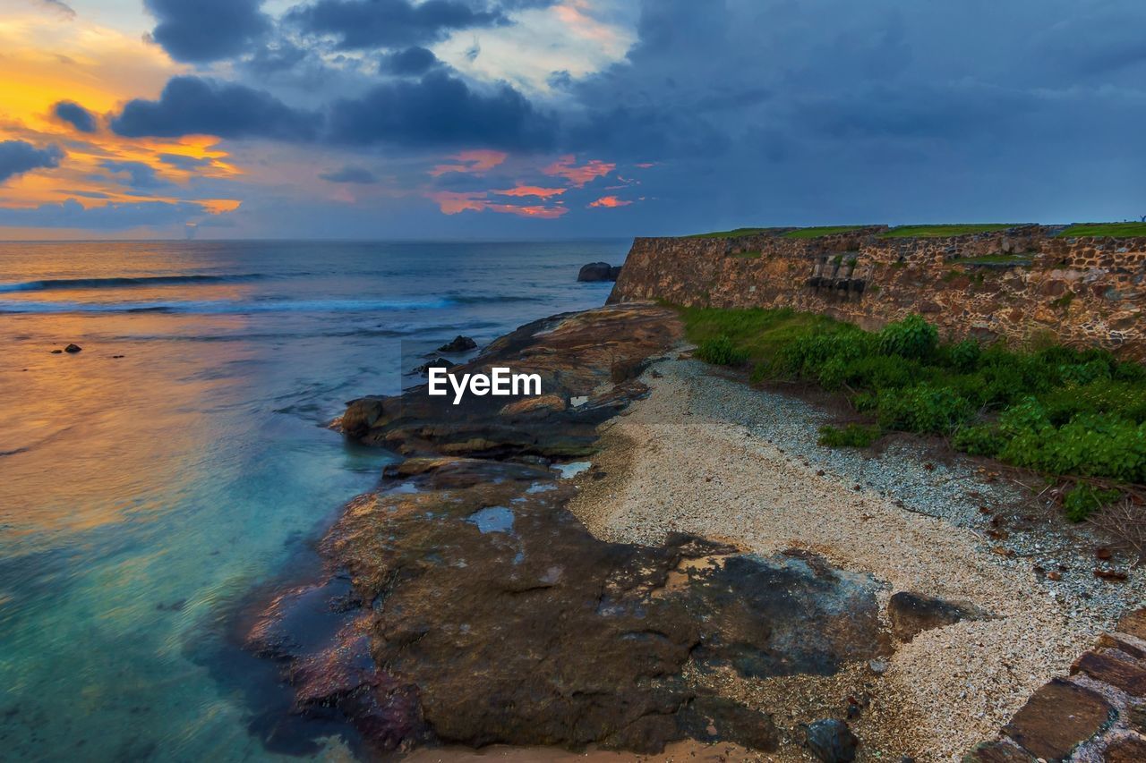 Scenic view of sea against sky during sunset