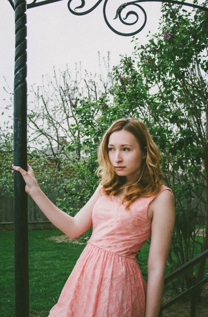 Beautiful young woman looking away outdoors