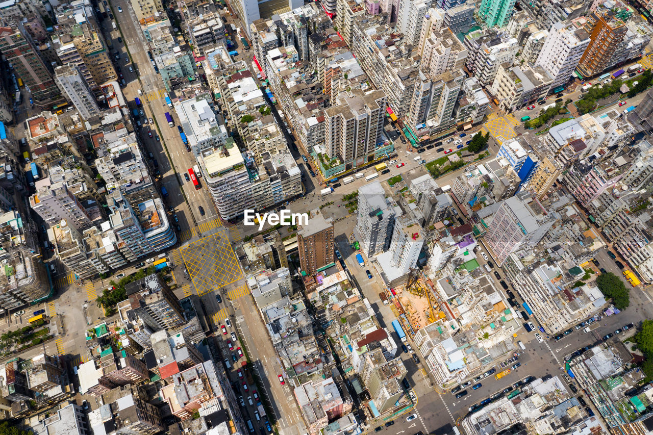 HIGH ANGLE VIEW OF CROWD ON STREET
