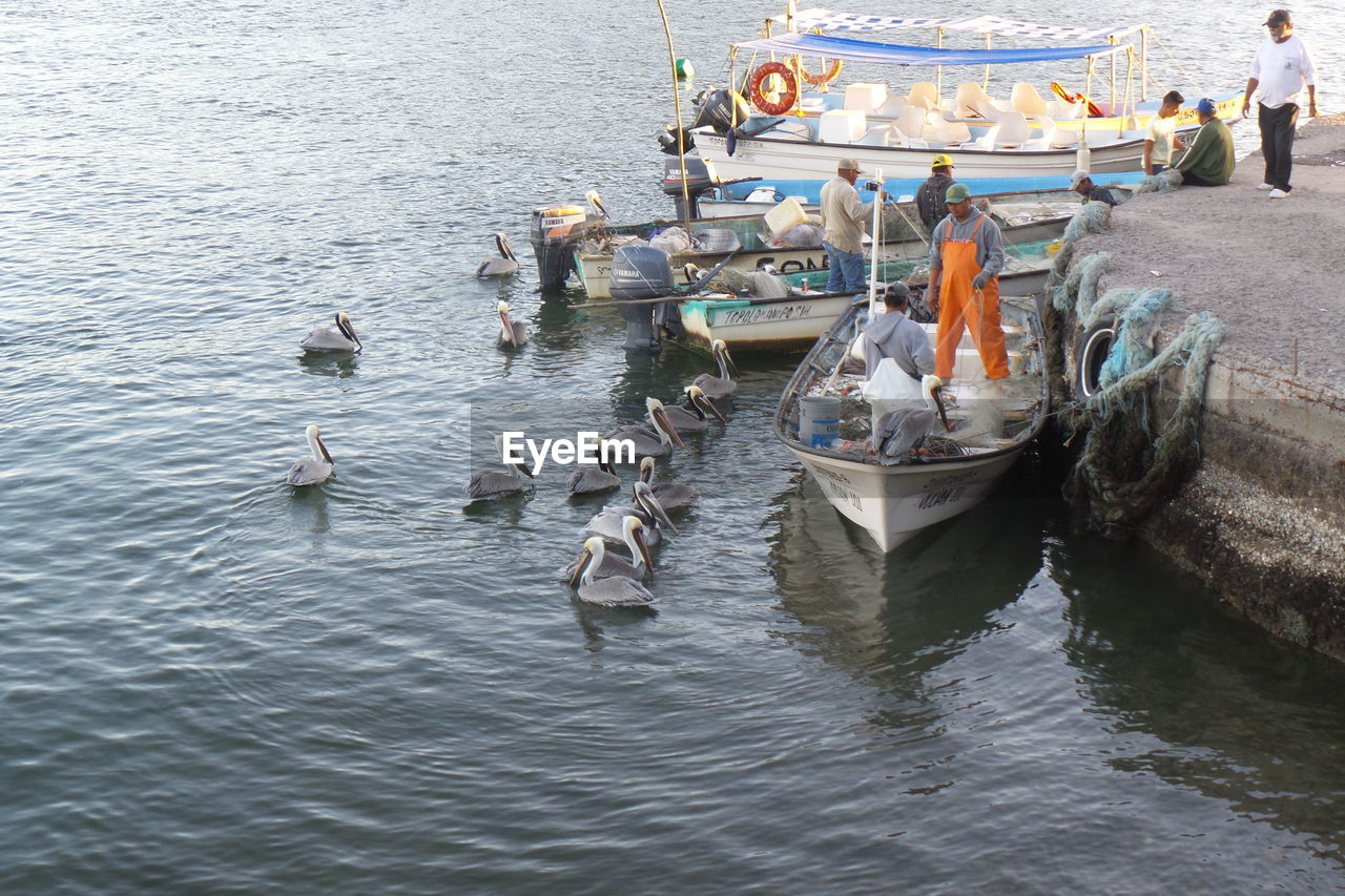 BOATS MOORED IN WATER