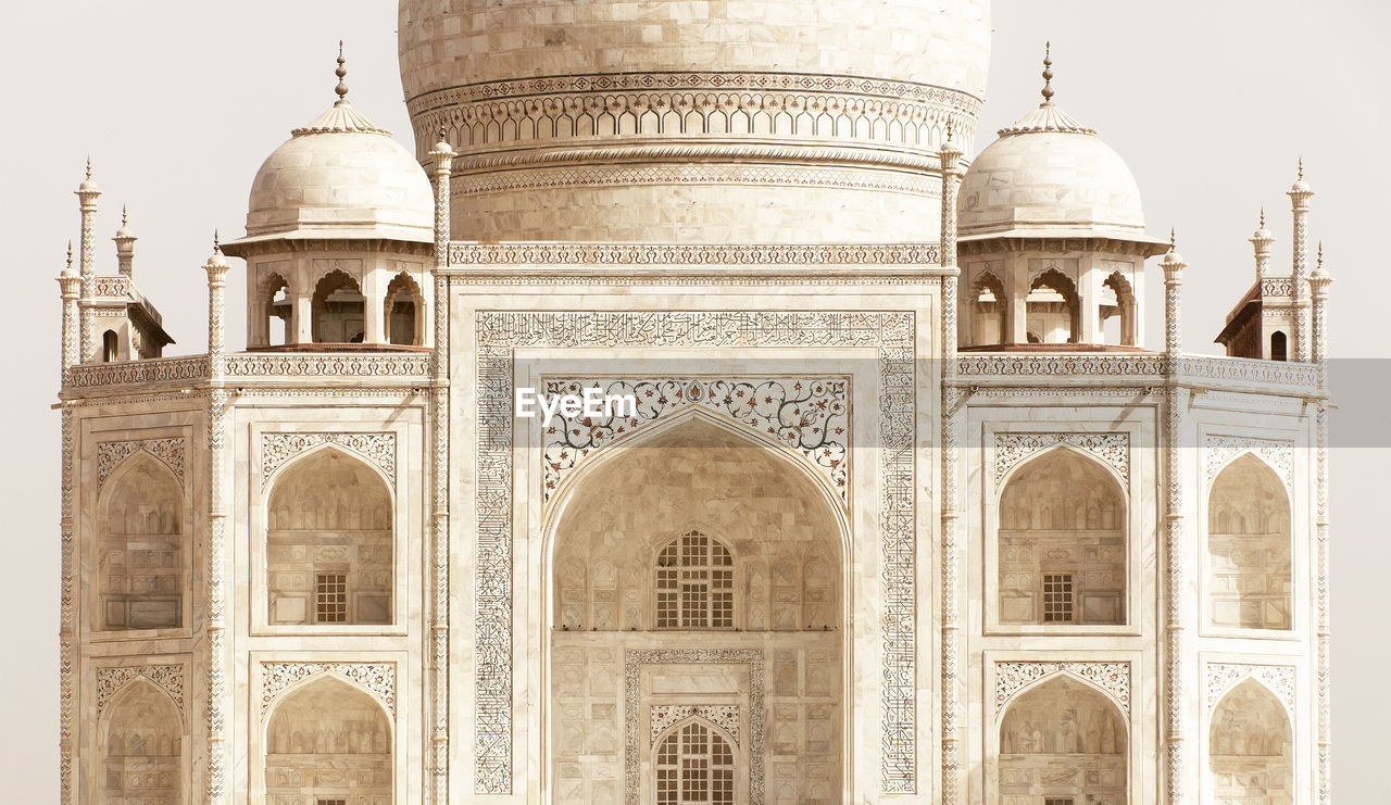 Low angle view of taj mahal against clear sky on sunny day