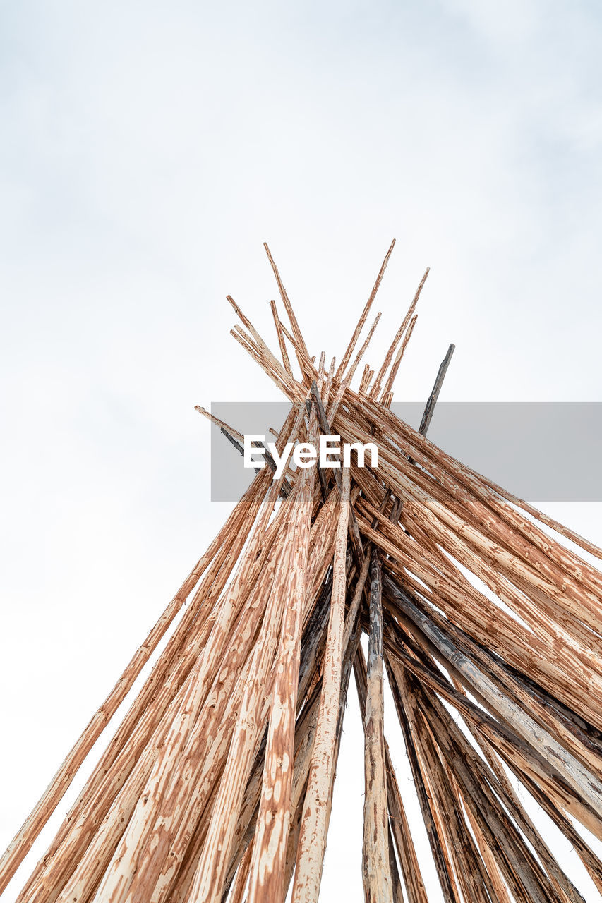 Low angle view of bamboo structure against sky