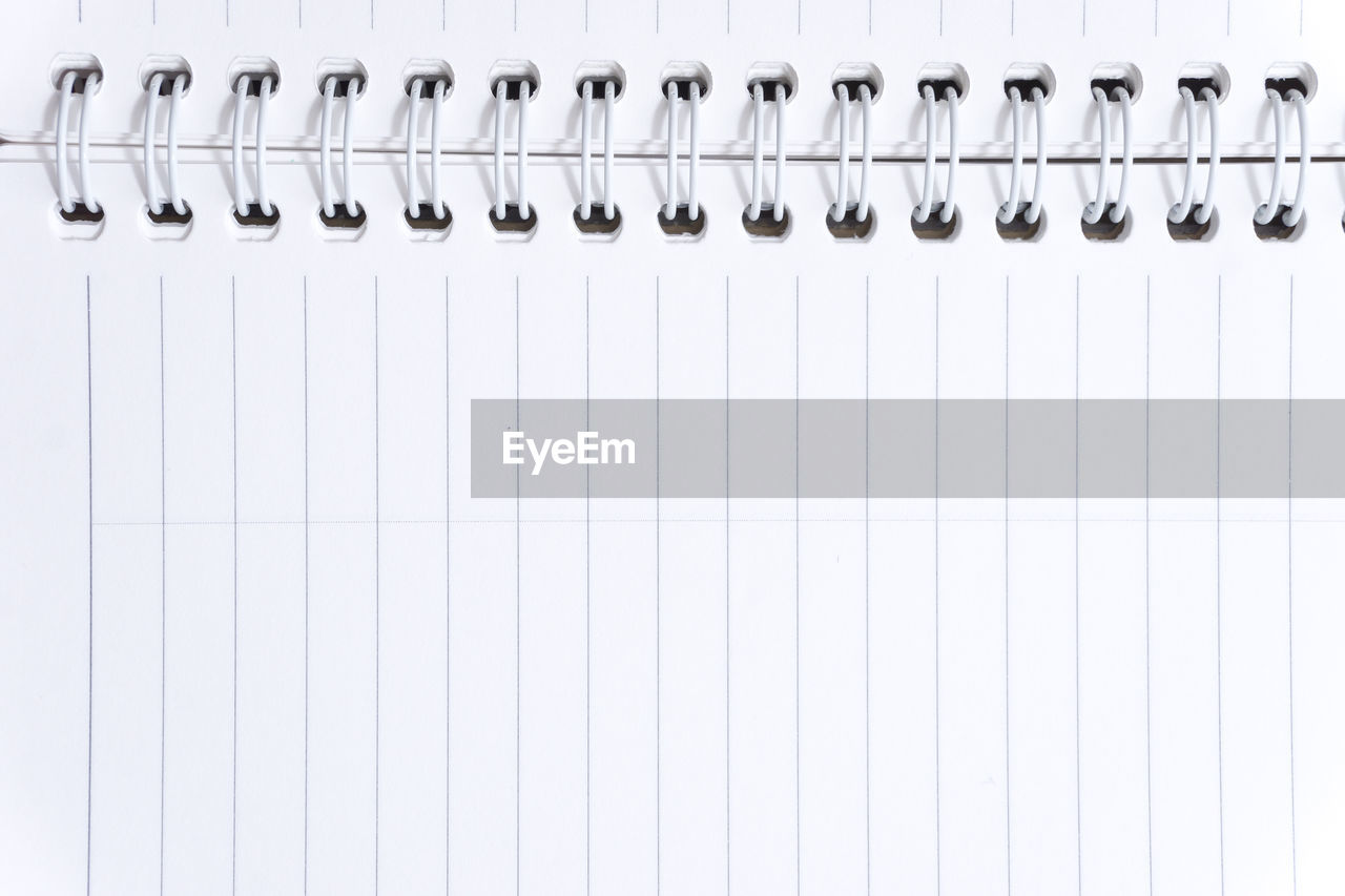 Full frame shot of open blank spiral notebook