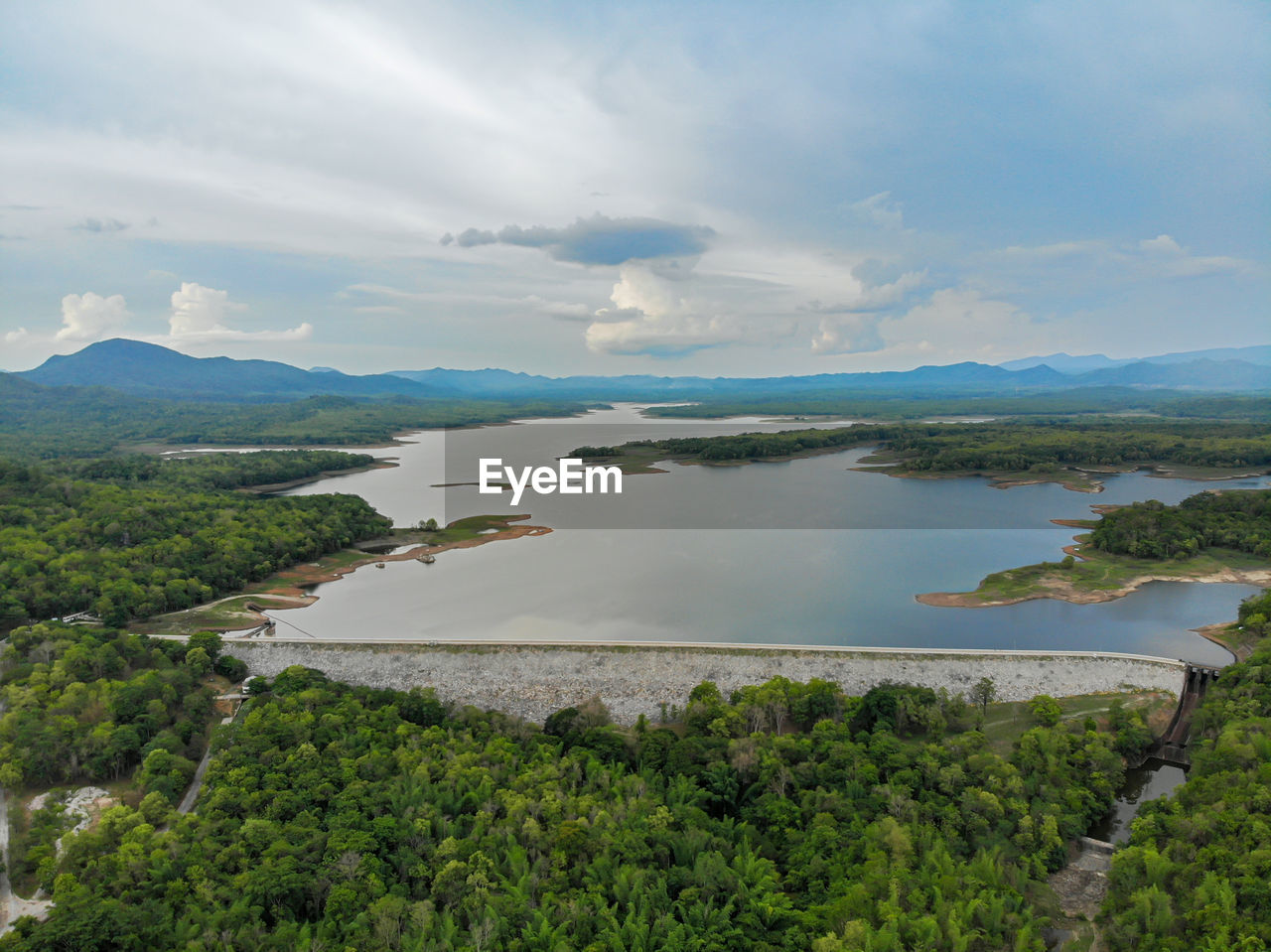 SCENIC VIEW OF LAKE BY TREES AGAINST SKY