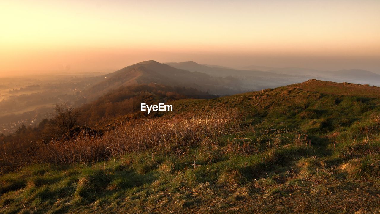 Scenic view of landscape against sky during sunset