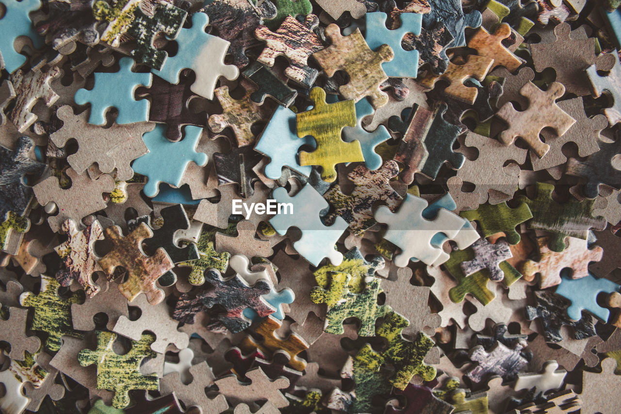 HIGH ANGLE VIEW OF MULTI COLORED ART ON TABLE