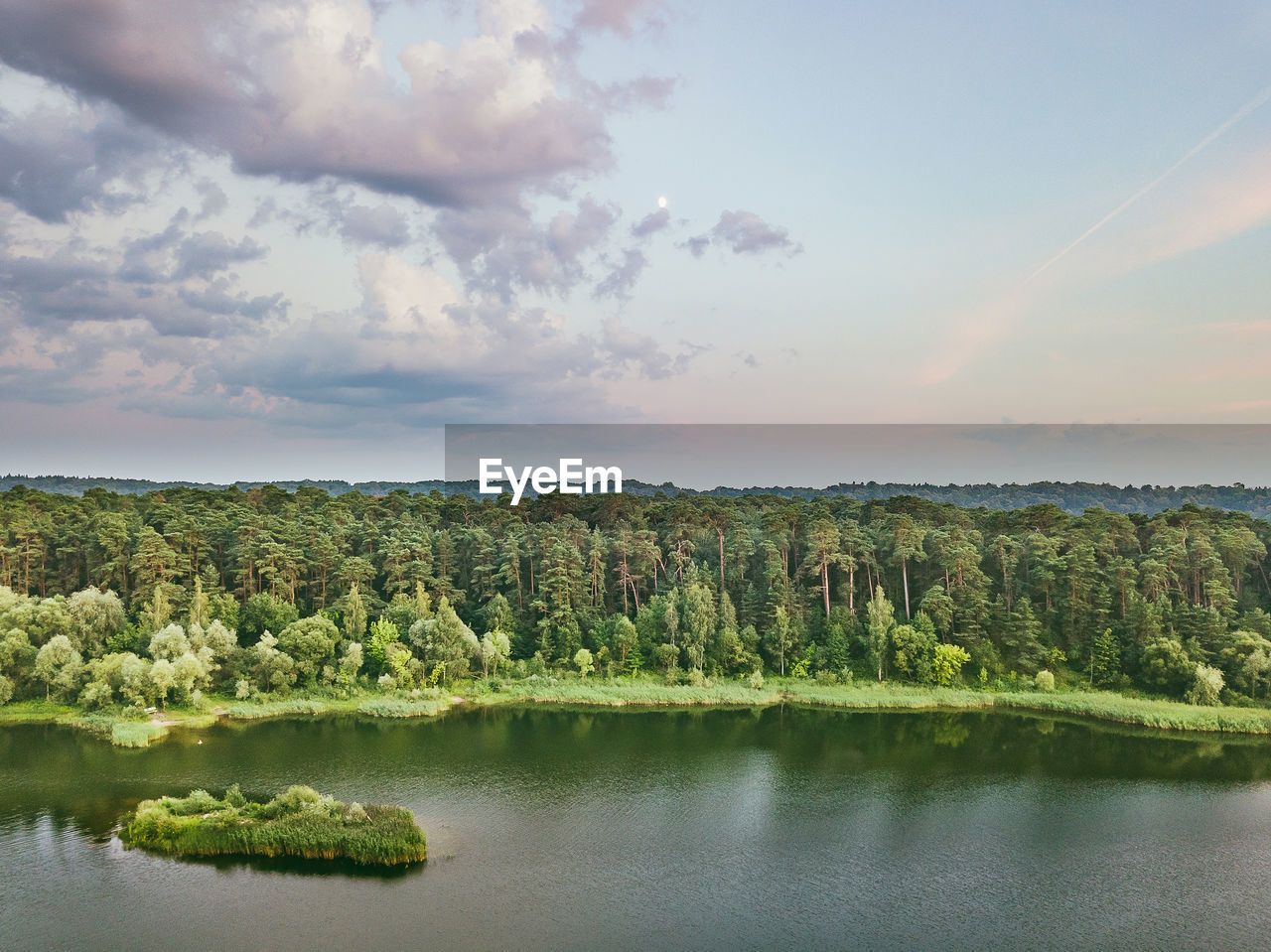 Scenic view of lake against sky during sunset