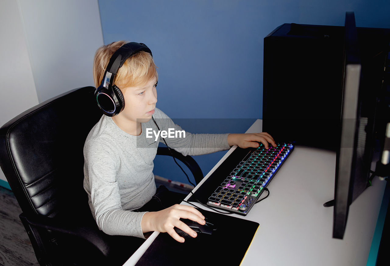 Young boy playing computer games