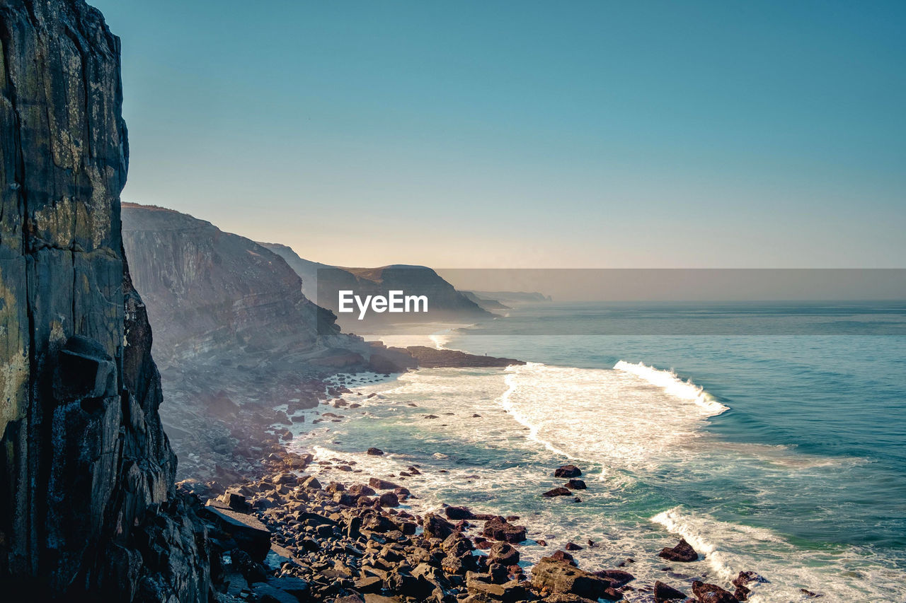 Scenic view of sea against clear sky