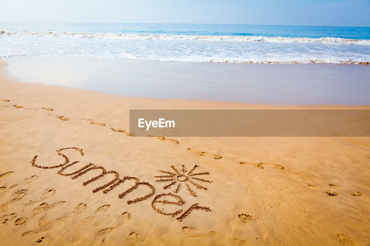 Text on sand at beach