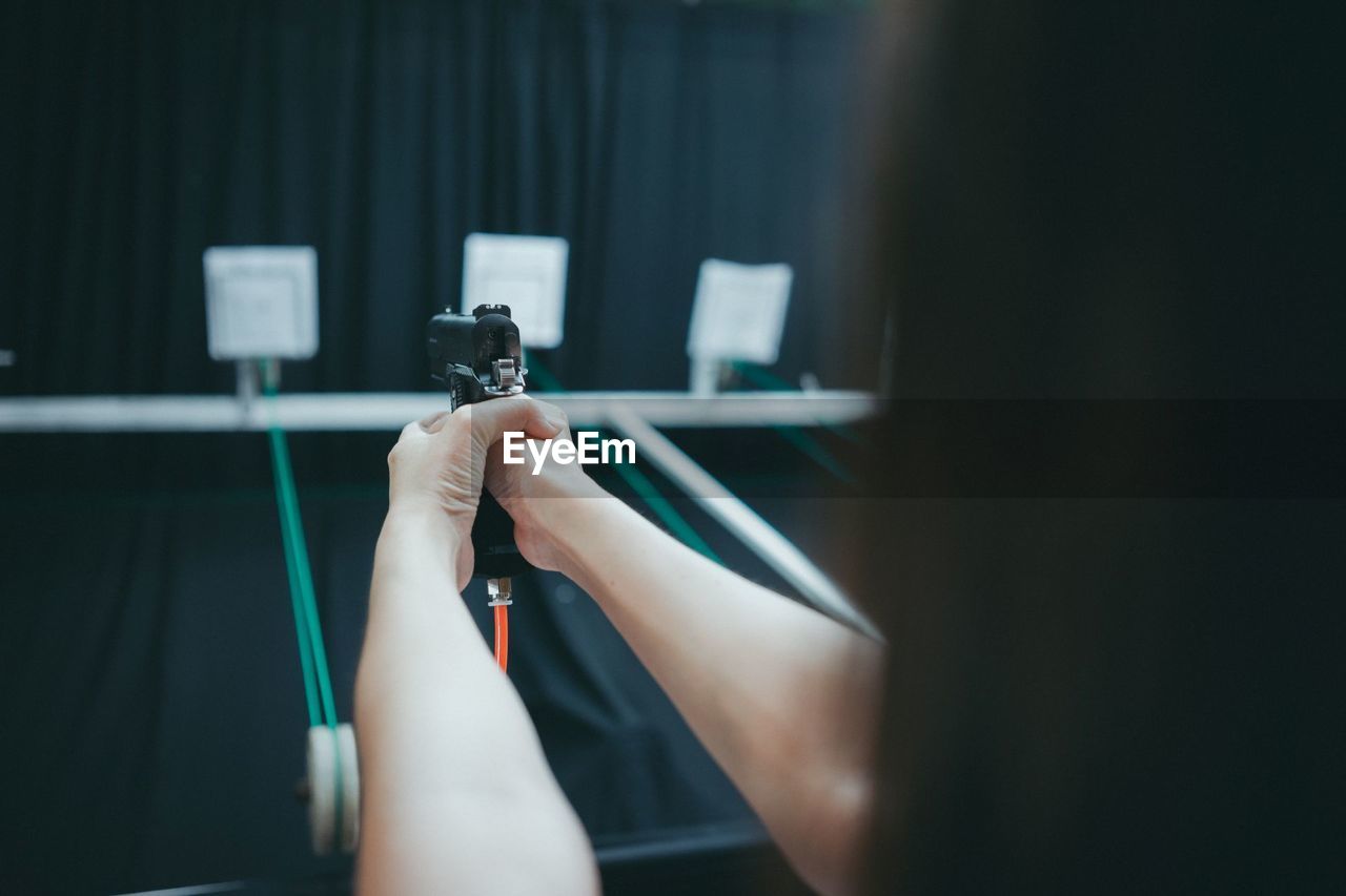 Close-up of woman target shooting
