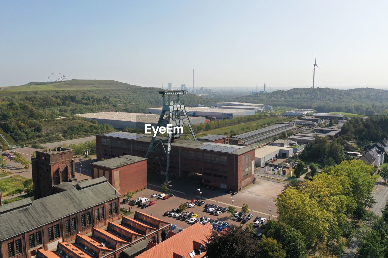 High angle view of buildings against clear sky, industrial area in germany