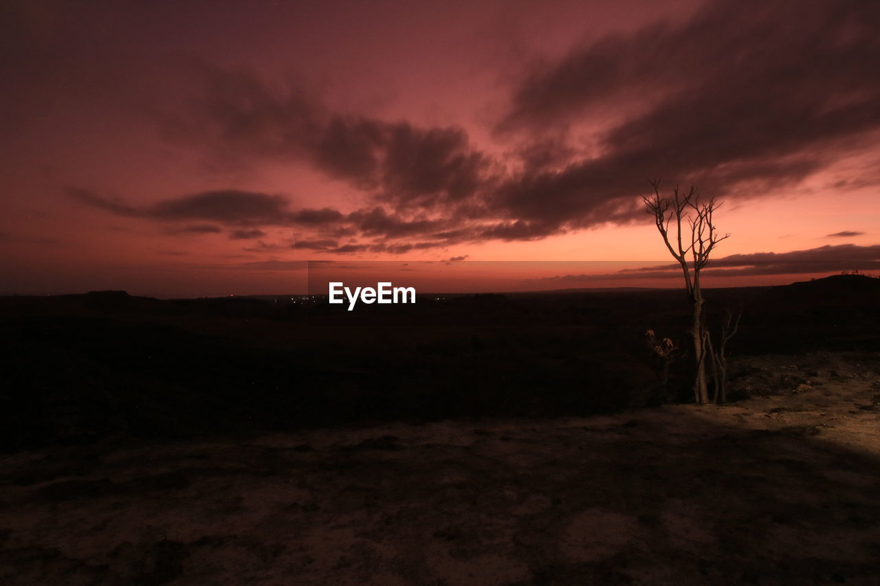 Scenic view of silhouette landscape against sky during sunset