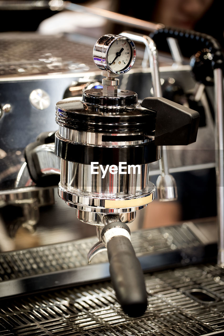 espresso machine, coffeemaker, drink, espresso maker, coffee, metal, machinery, indoors, food and drink, close-up, appliance, focus on foreground, no people