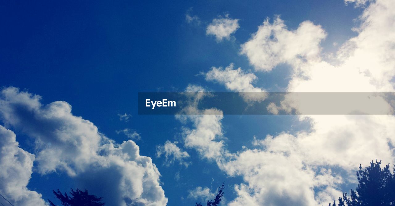 Low angle view of blue sky and clouds