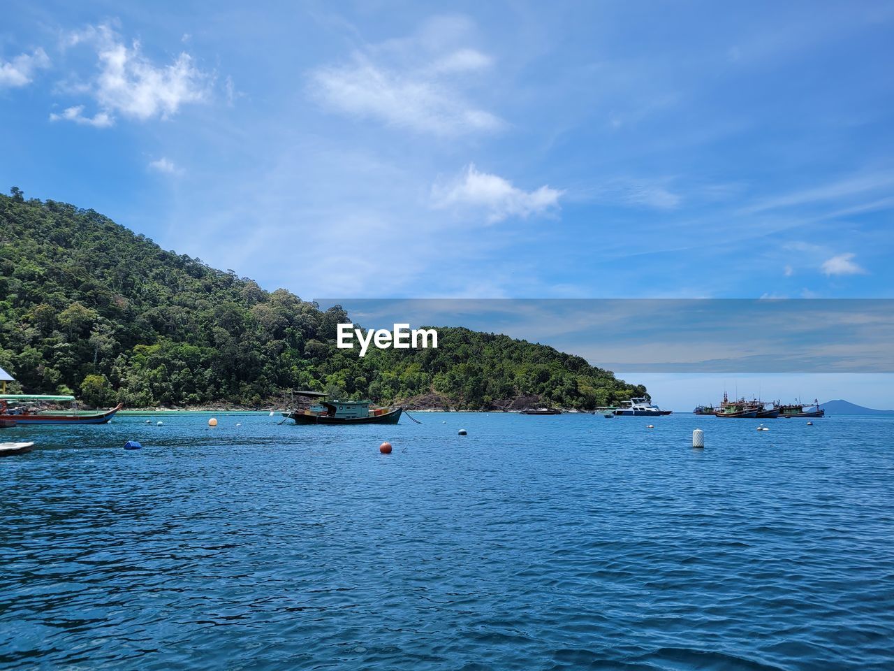 water, sea, sky, nautical vessel, land, scenics - nature, nature, travel, transportation, beauty in nature, tree, cloud, travel destinations, blue, beach, tranquility, environment, tourism, island, body of water, plant, holiday, vacation, trip, tranquil scene, mode of transportation, shore, no people, landscape, tropical climate, coastline, mountain, idyllic, outdoors, bay, day, bay of water, lagoon, vehicle, architecture, coast, summer, ship, seascape, non-urban scene, ocean, waterfront, forest