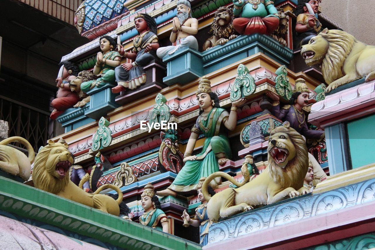 LOW ANGLE VIEW OF STATUES ON TEMPLE