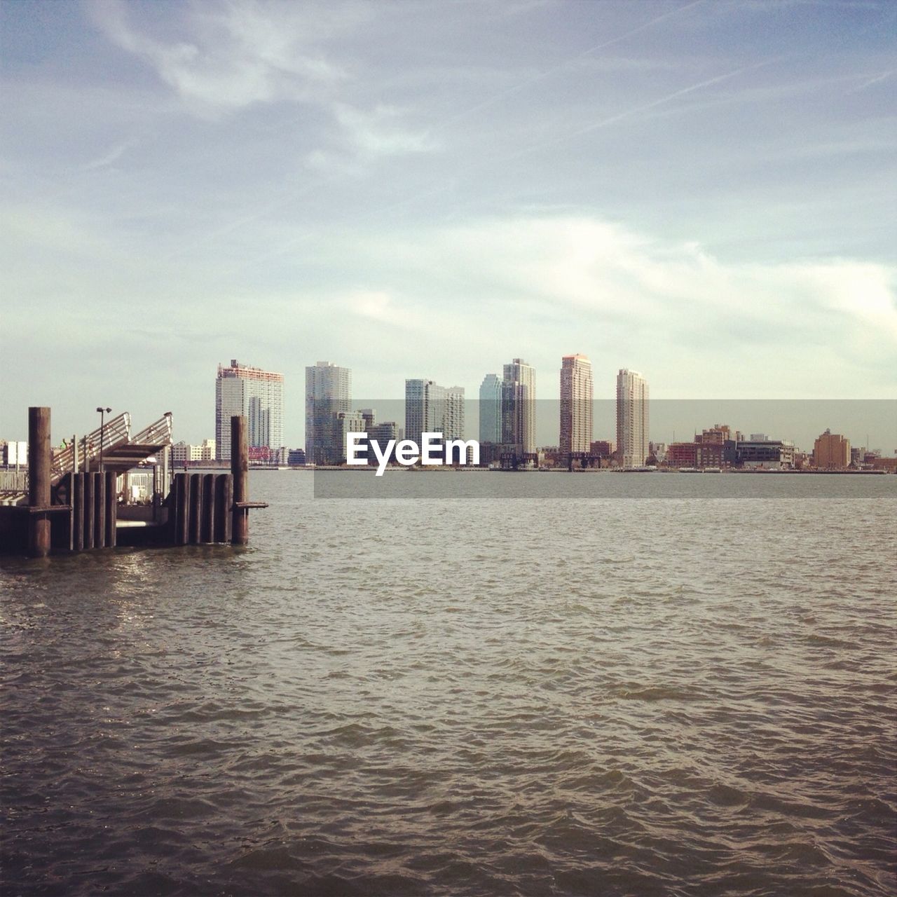 River and city skyline against sky