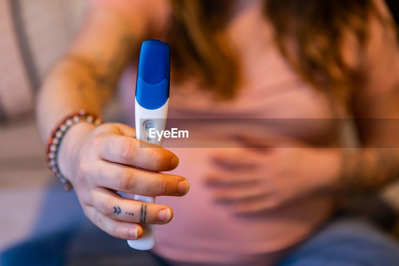 Close-up of woman holding hands
