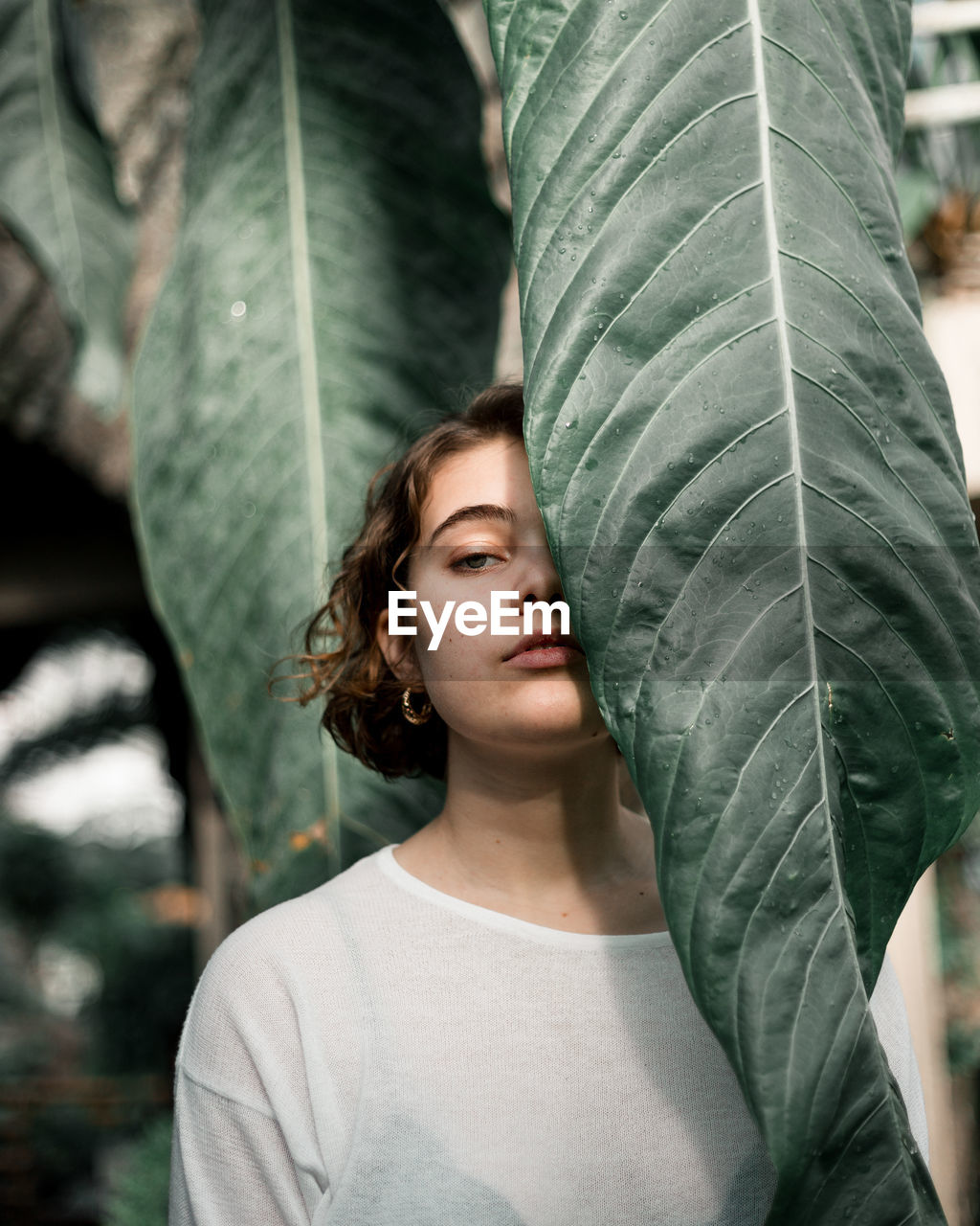 Portrait of woman by plants